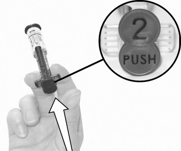 2. Depress (Push) the plunger rod. This will loosen the plunger rod that is located on the outside of the syringe barrel so that the plunger rod can be removed. This will also engage syringe.