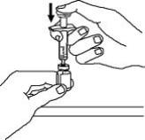 8.	Once the twist off cap is removed, pick up the vial adapter with your free hand.  Twist the vial adapter onto the syringe, turning clockwise until you feel a slight resistance.  Do not over tighten.