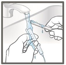 11. Remove the plunger from the barrel of the oral syringe and rinse both parts under tap water.