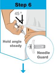 A close-up of a person holding a syringe

Description automatically generated